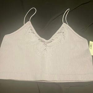 Purple form fitting fabric crop top.